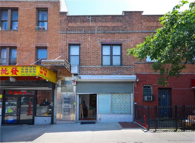 a front view of a building with garden