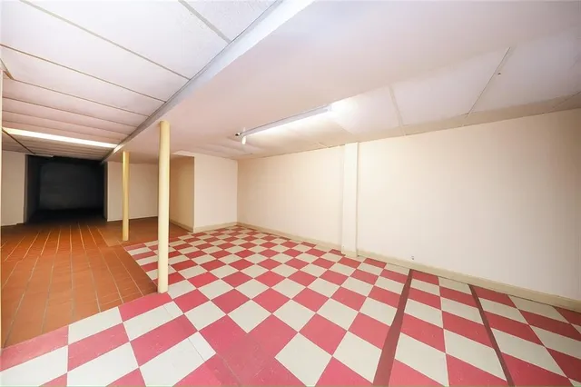 a bedroom with a bed and a black walk in closet