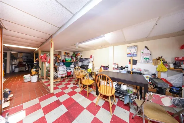 a view of a dining hall with lots of tables and chairs