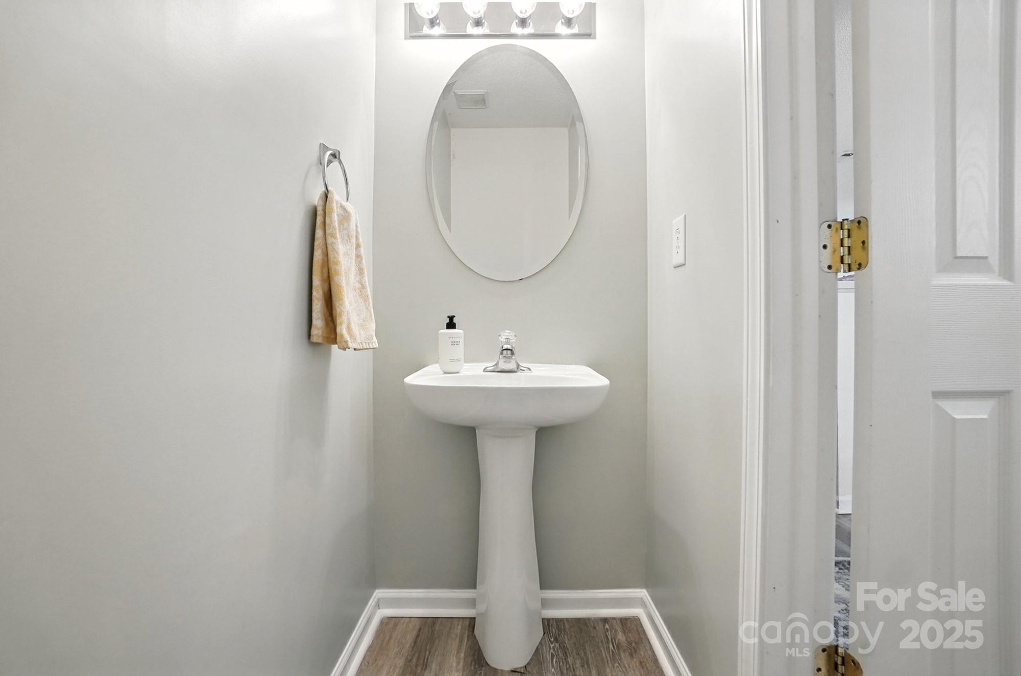 8130 Rudolph Road Charlotte, NC 28216 - Photo 12 of 36 a bathroom with a sink and a mirror