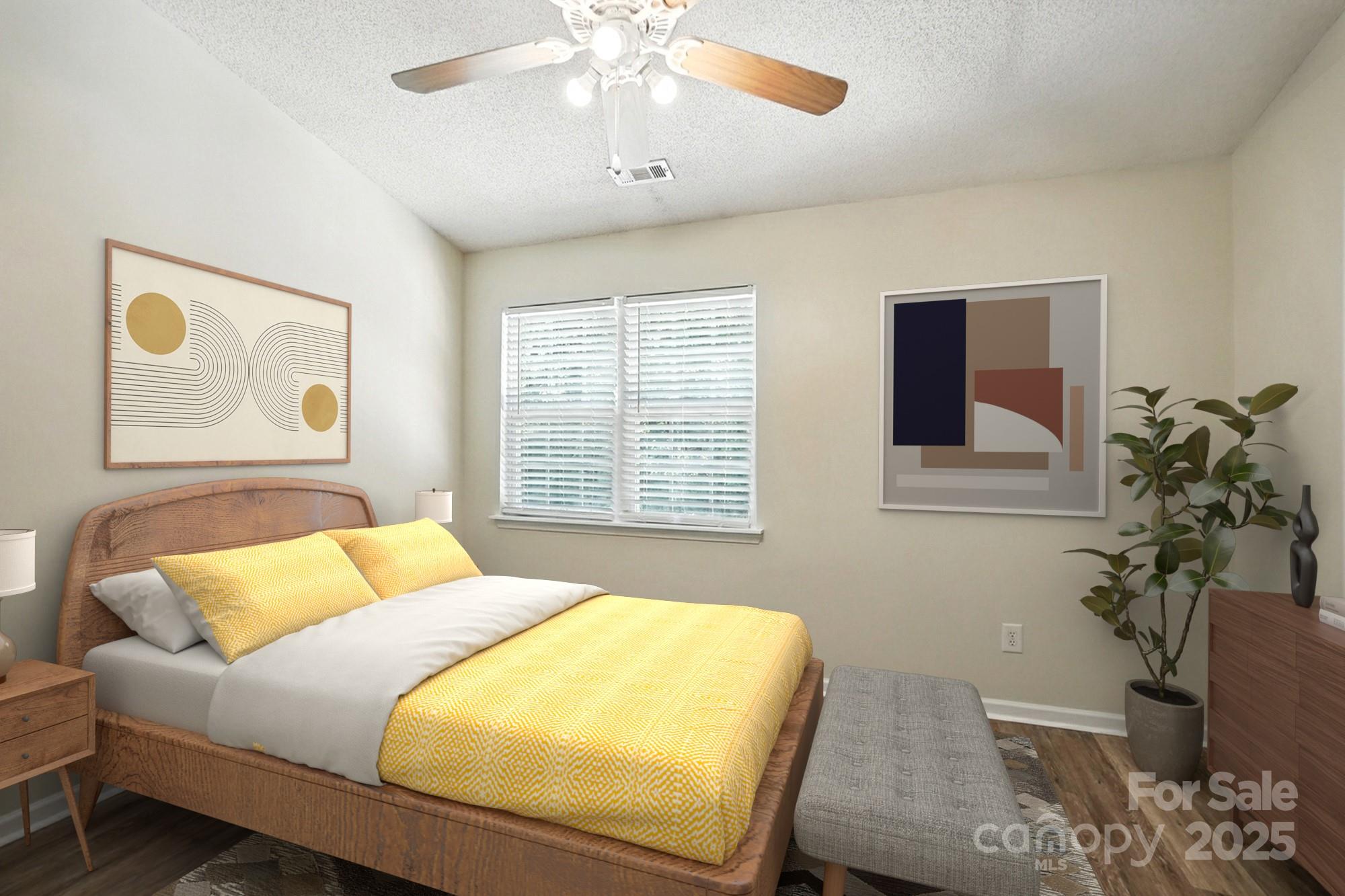 8130 Rudolph Road Charlotte, NC 28216 - Photo 13 of 36 a bedroom with a bed and a potted plant