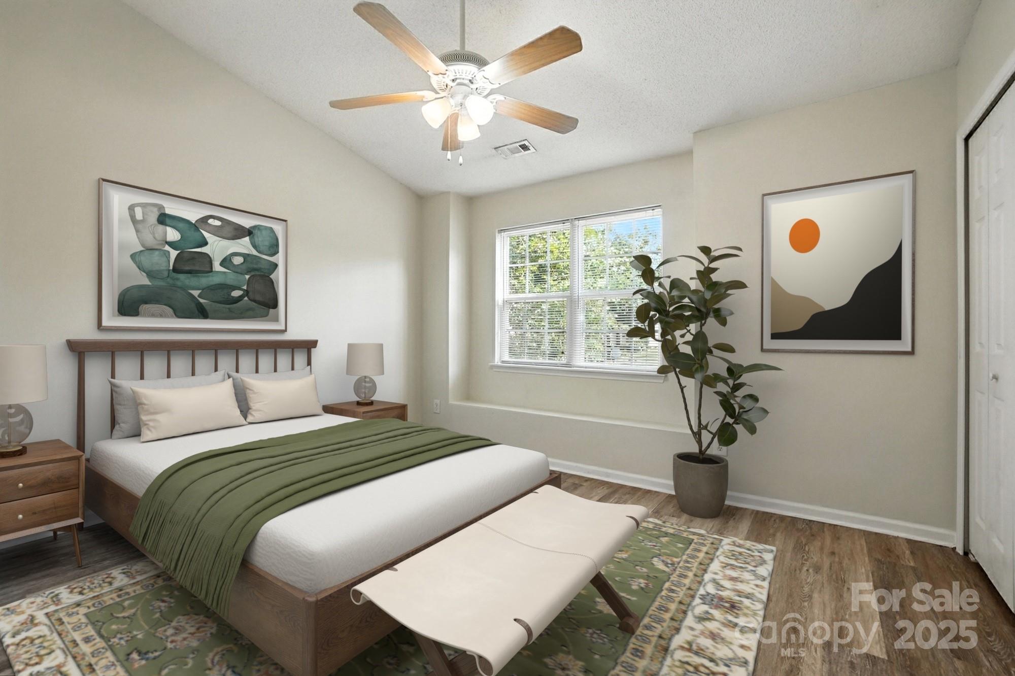8130 Rudolph Road Charlotte, NC 28216 - Photo 17 of 36 a bedroom with a bed and a window