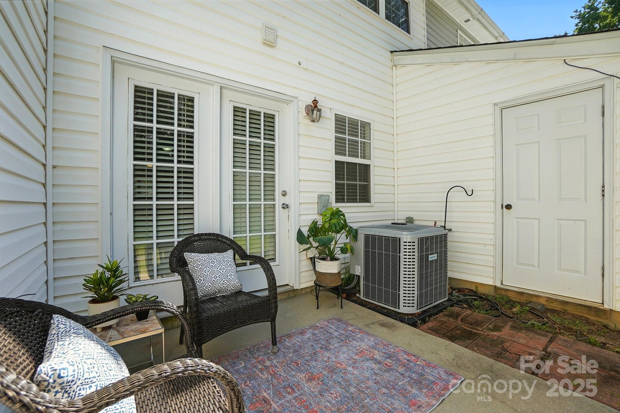 8130 Rudolph Road Charlotte, NC 28216 - Photo 19 of 36 a building outdoor space with patio furniture