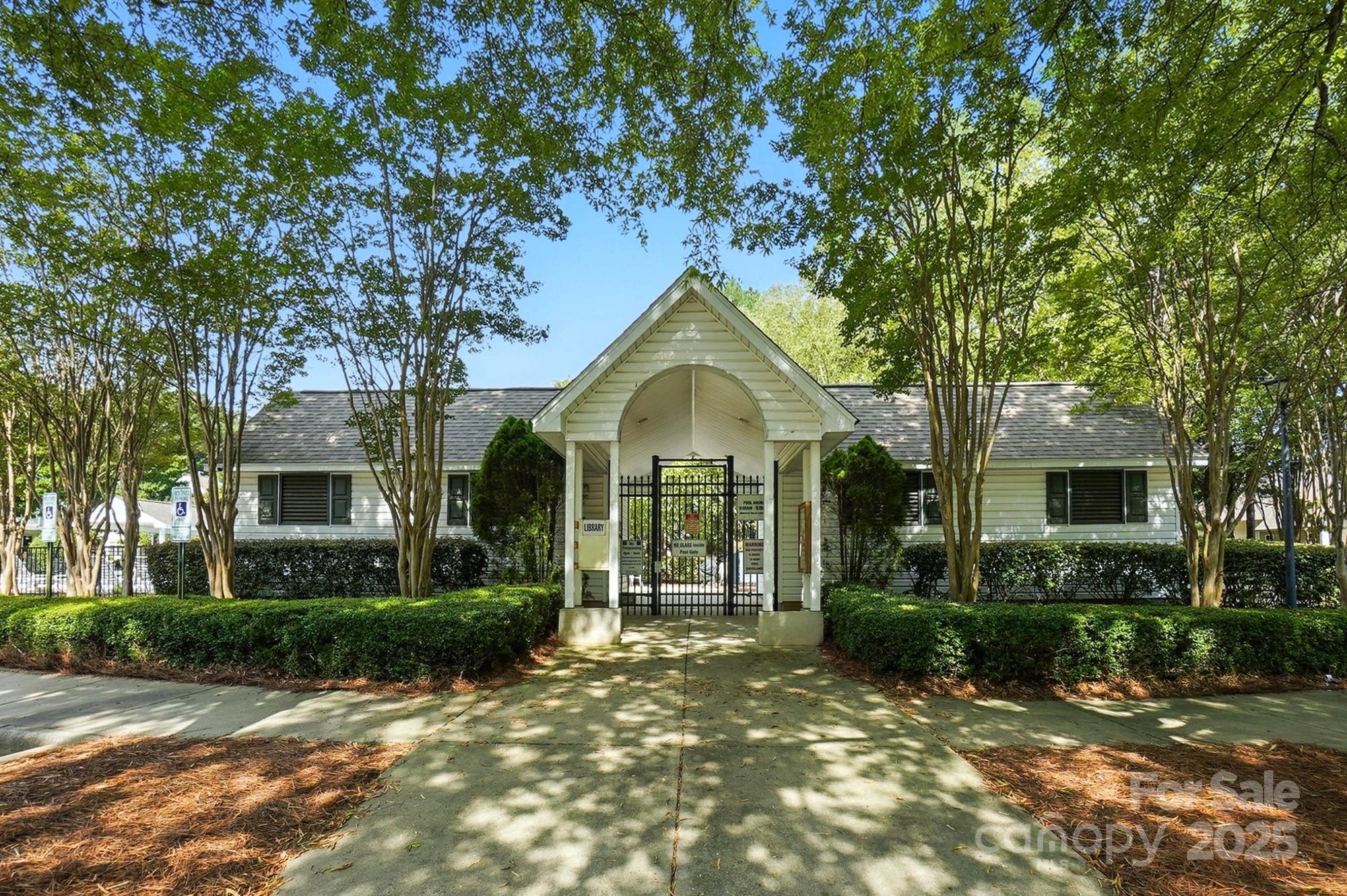 8130 Rudolph Road Charlotte, NC 28216 - Photo 23 of 36 a front view of a house with garden