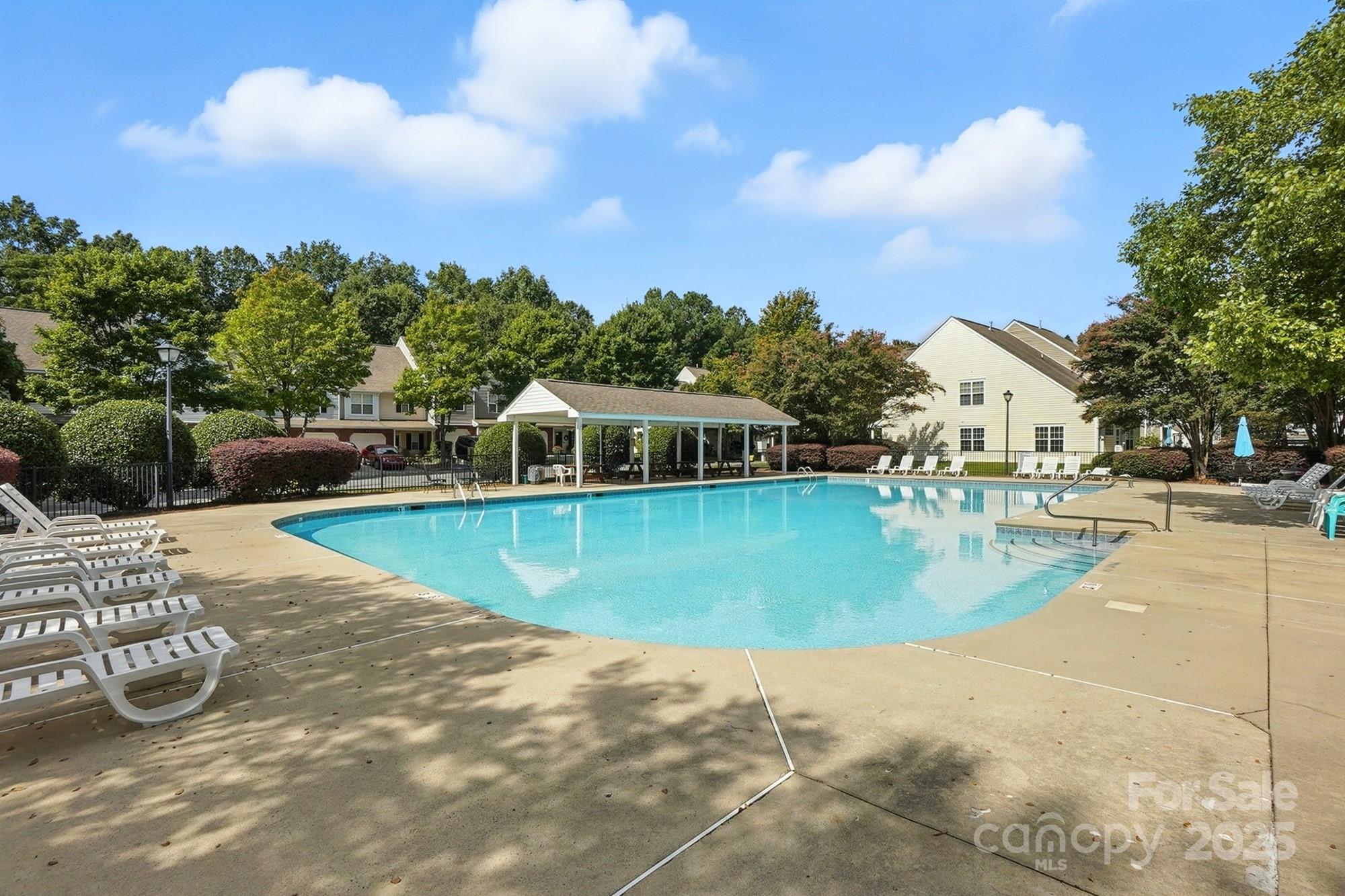 8130 Rudolph Road Charlotte, NC 28216 - Photo 24 of 36 a view of a swimming pool with a patio