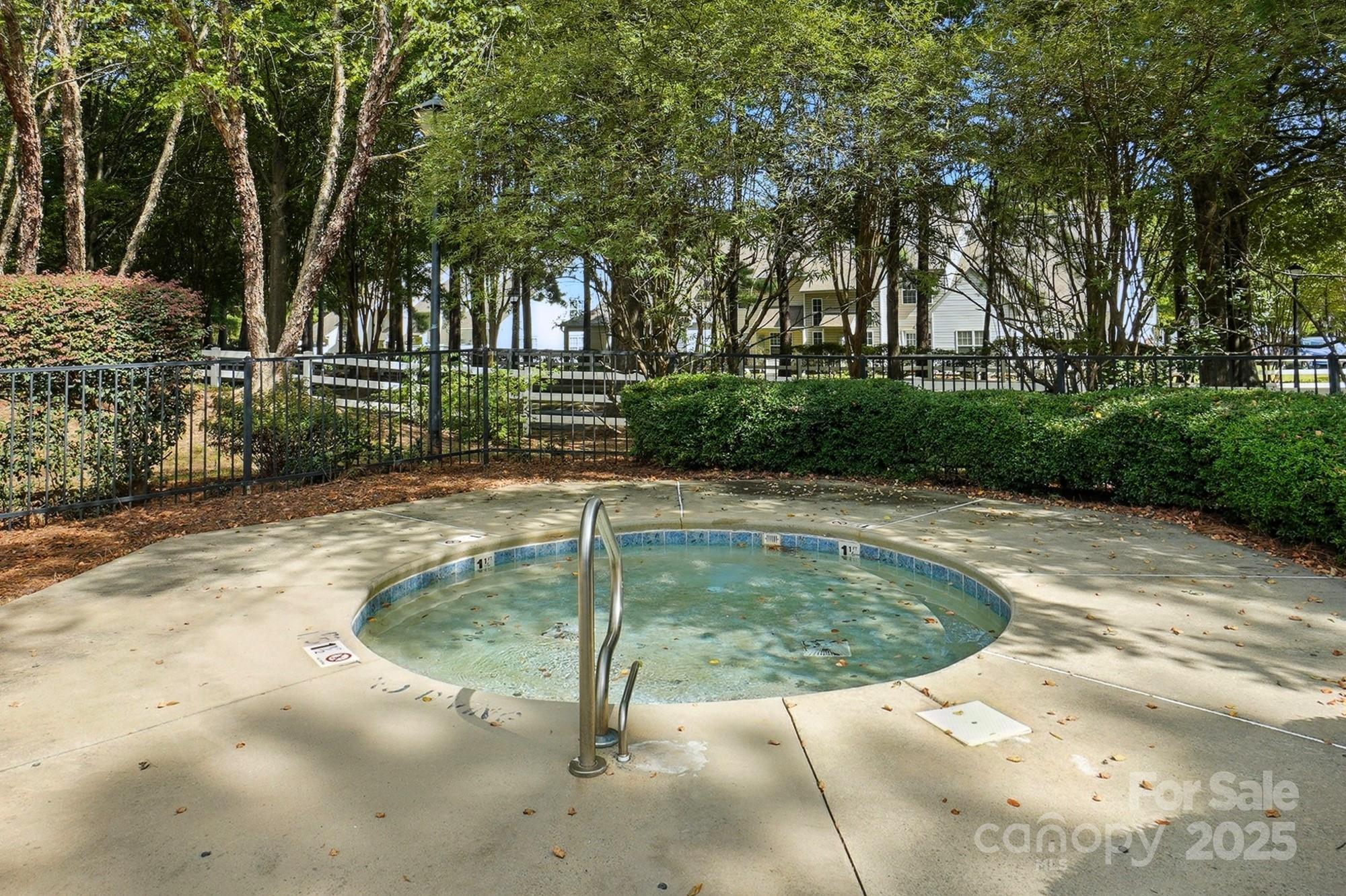 8130 Rudolph Road Charlotte, NC 28216 - Photo 26 of 36 a view of a swimming pool with a patio