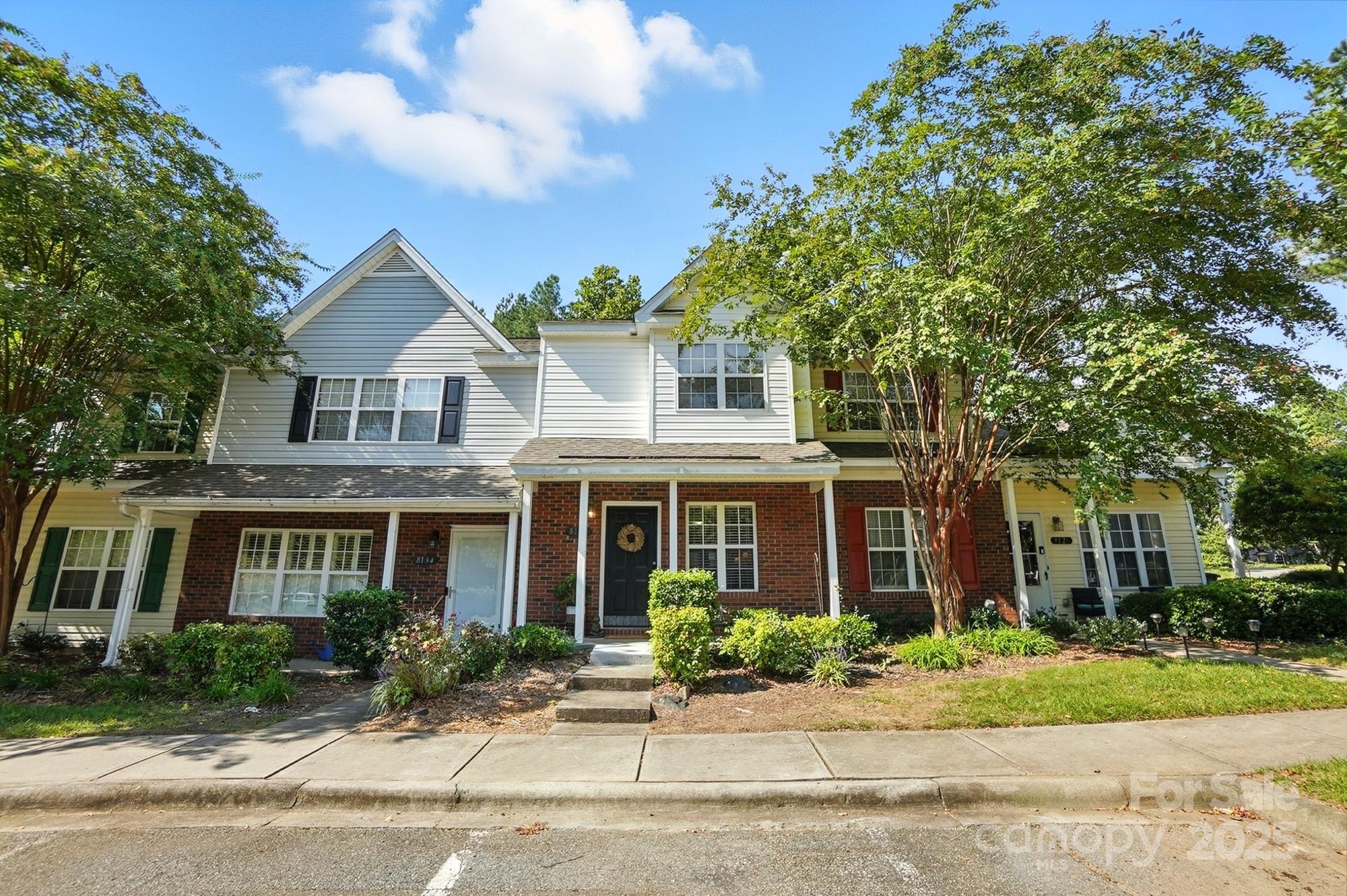 8130 Rudolph Road Charlotte, NC 28216 - Photo 3 of 36 a front view of a house with a garden
