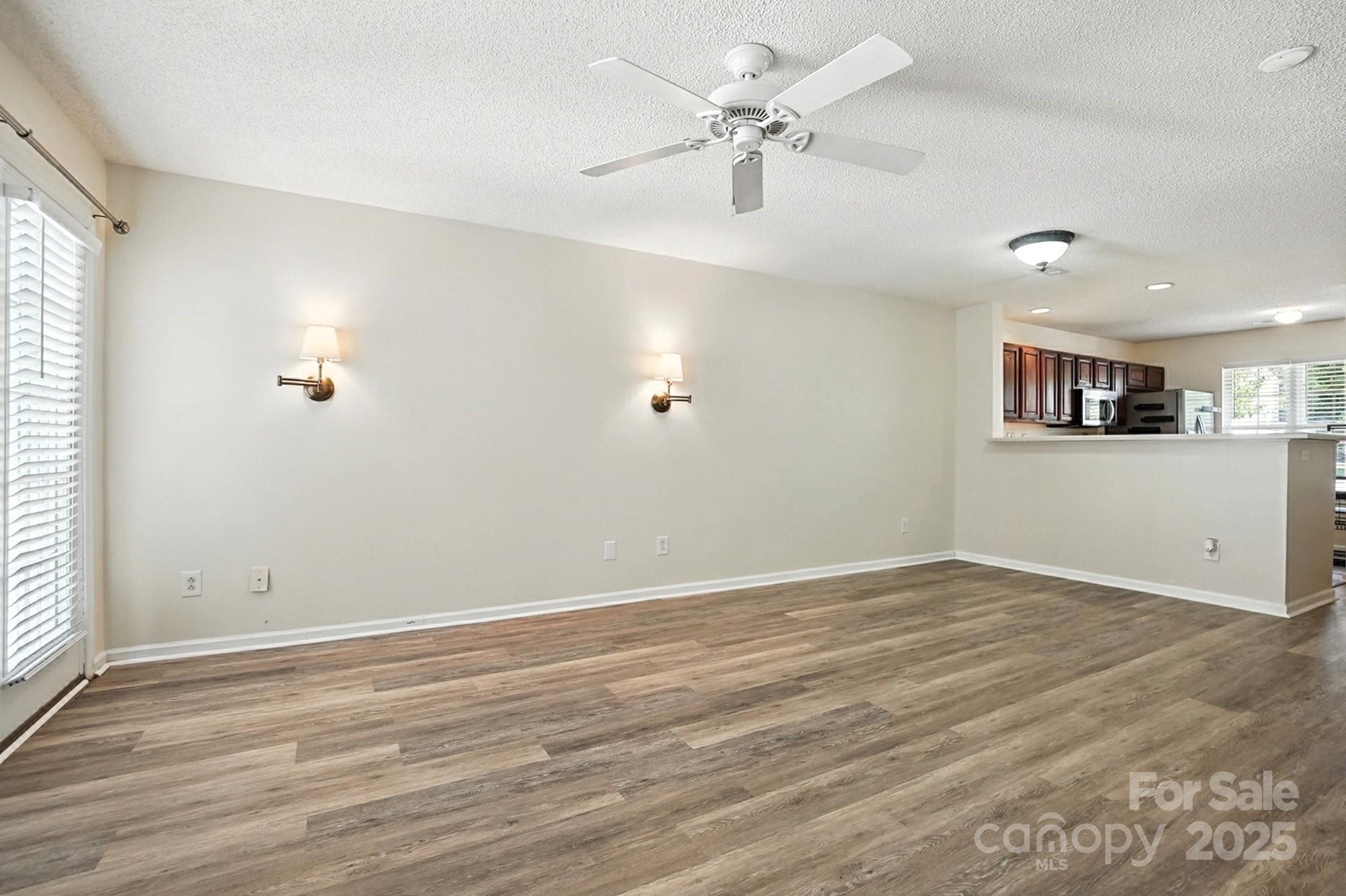 8130 Rudolph Road Charlotte, NC 28216 - Photo 32 of 36 wooden floor in an empty room with a window