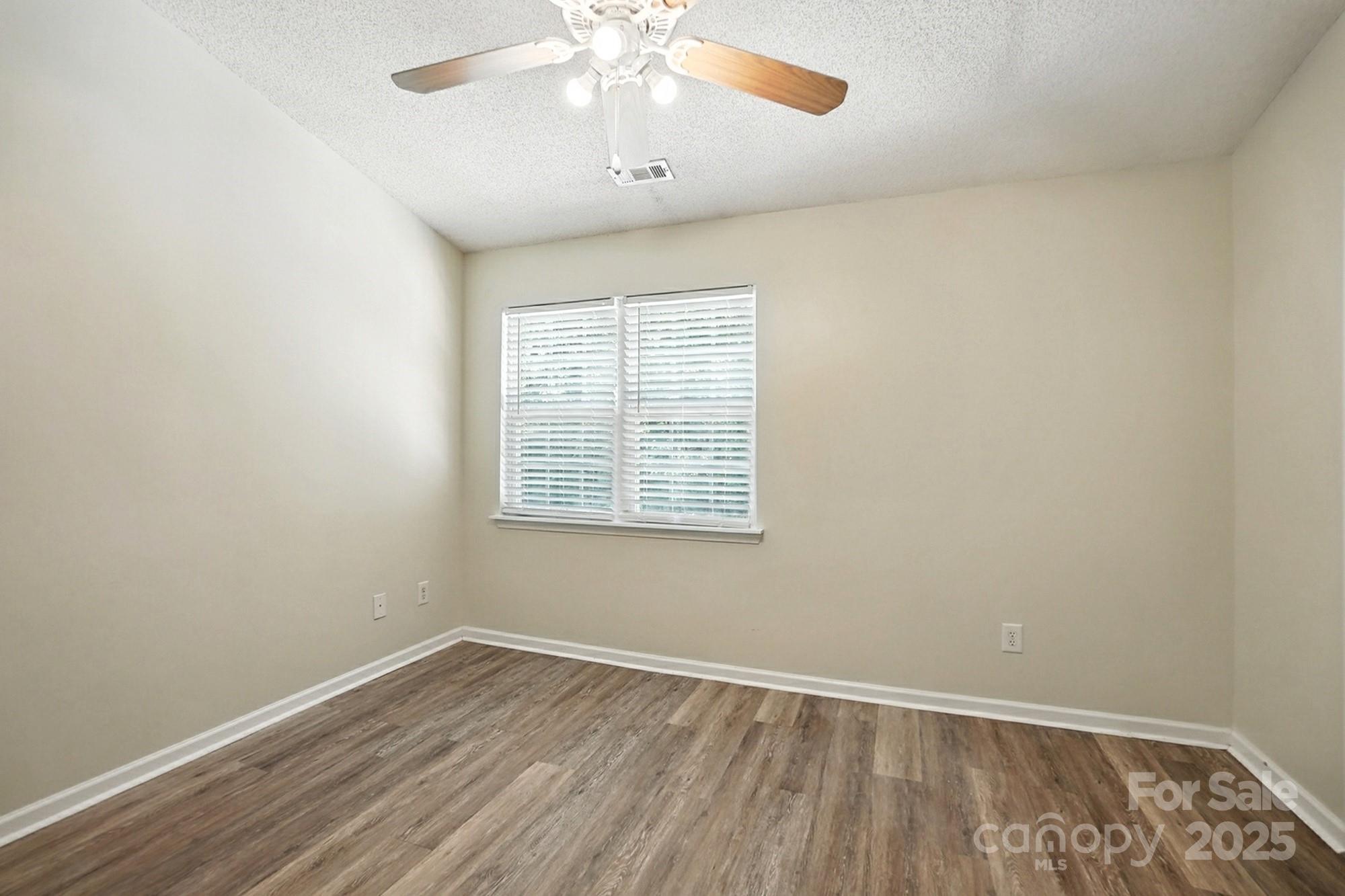 8130 Rudolph Road Charlotte, NC 28216 - Photo 34 of 36 an empty room with a window