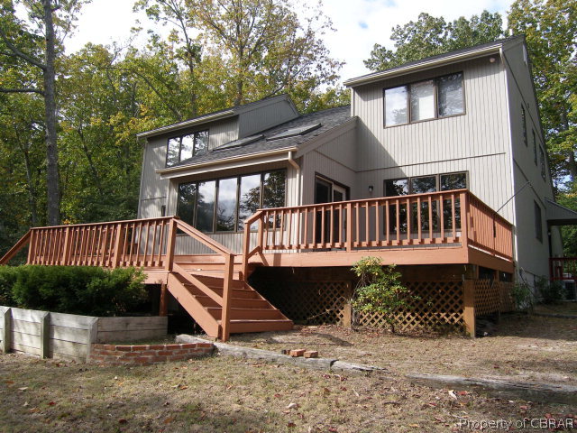 879 West Point Road Lancaster, VA 22503 - Photo 2 of 38 a view of a house with wooden deck