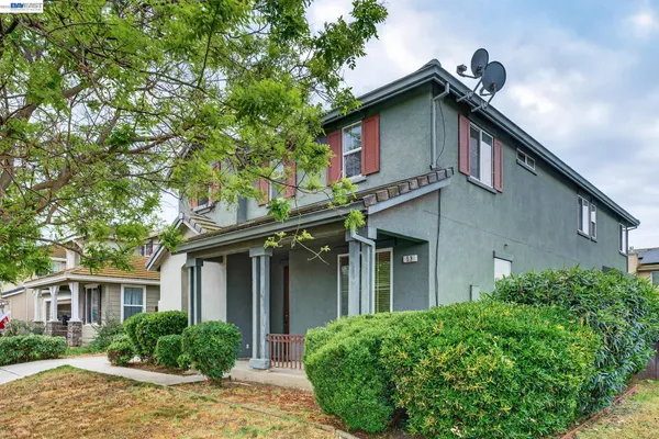 a view of a room with wooden floor and stairs