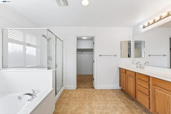 a view of a small space with wooden floor and a window