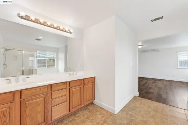 a view of a backyard with plants and outdoor seating