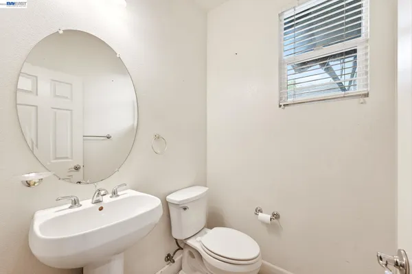 an aerial view of a house with a yard and pool