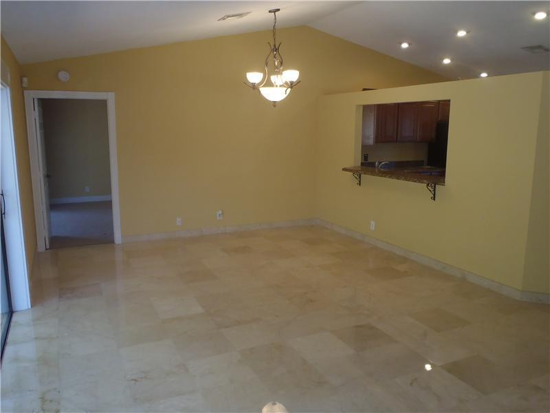 7589 Texas Trail Boca Raton, FL 33487 - Photo 6 of 13 a view of a livingroom with a flat screen tv