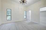 2001 Bering Drive, Unit 8J Houston, TX 77057 - Photo 15 of 36 an empty room with windows and entrance
