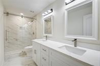 2001 Bering Drive, Unit 8J Houston, TX 77057 - Photo 20 of 36 a bathroom with a sink and a mirror