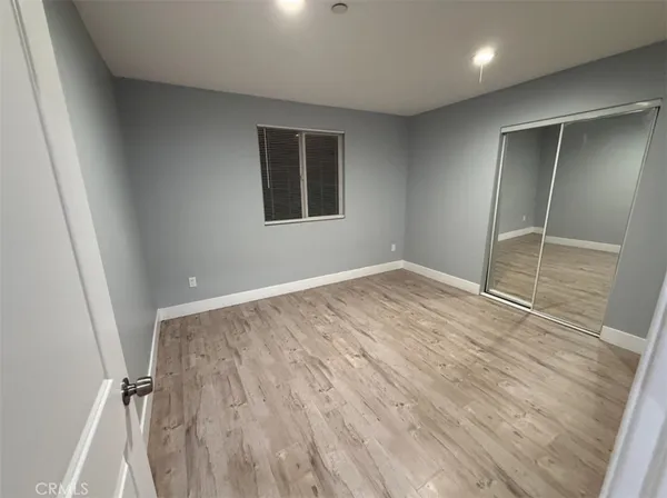 a kitchen with a refrigerator and a stove top oven