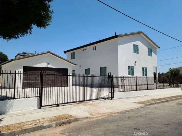 a view of a house with a snow in the yard