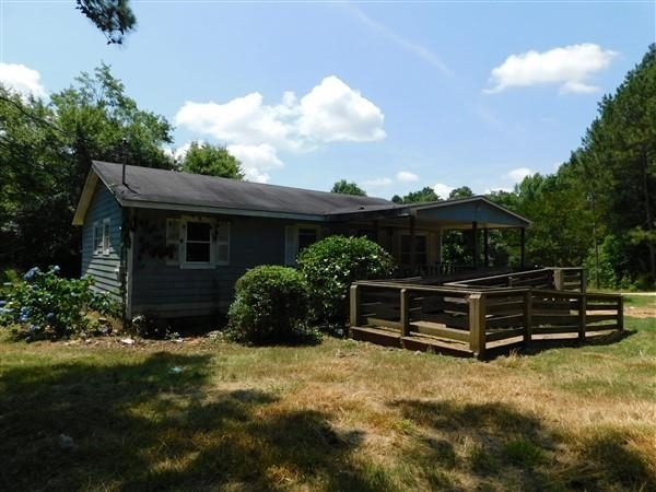 165 Noketchee Creek Road Athens, GA 30601 - Photo 1 of 1 a view of a house with backyard and sitting area