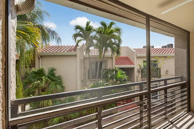 a vase of flowers sitting on a window sill