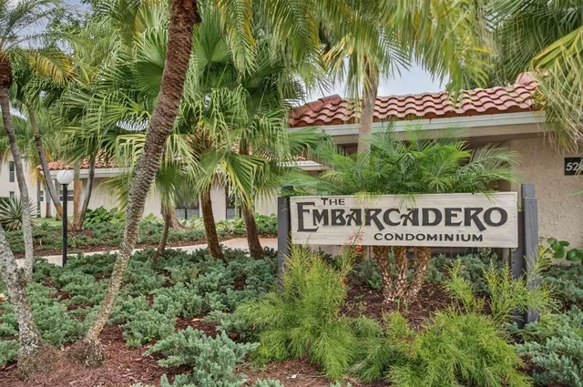 a sign that is sitting in front of a house