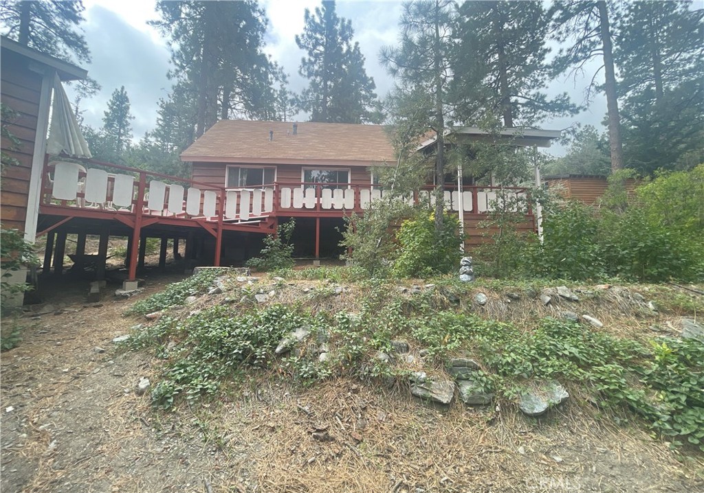 1057 Eagle Road Wrightwood, CA 92397 - Photo 1 of 10 a front view of a house with garden
