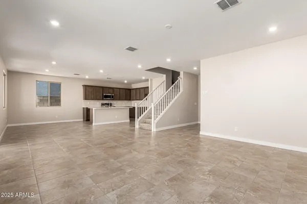 a view of a livingroom with a staircase