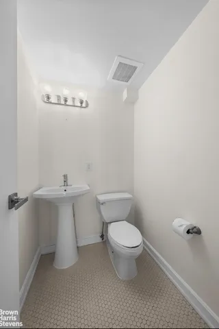 a bathroom with a sink a toilet and bathtub