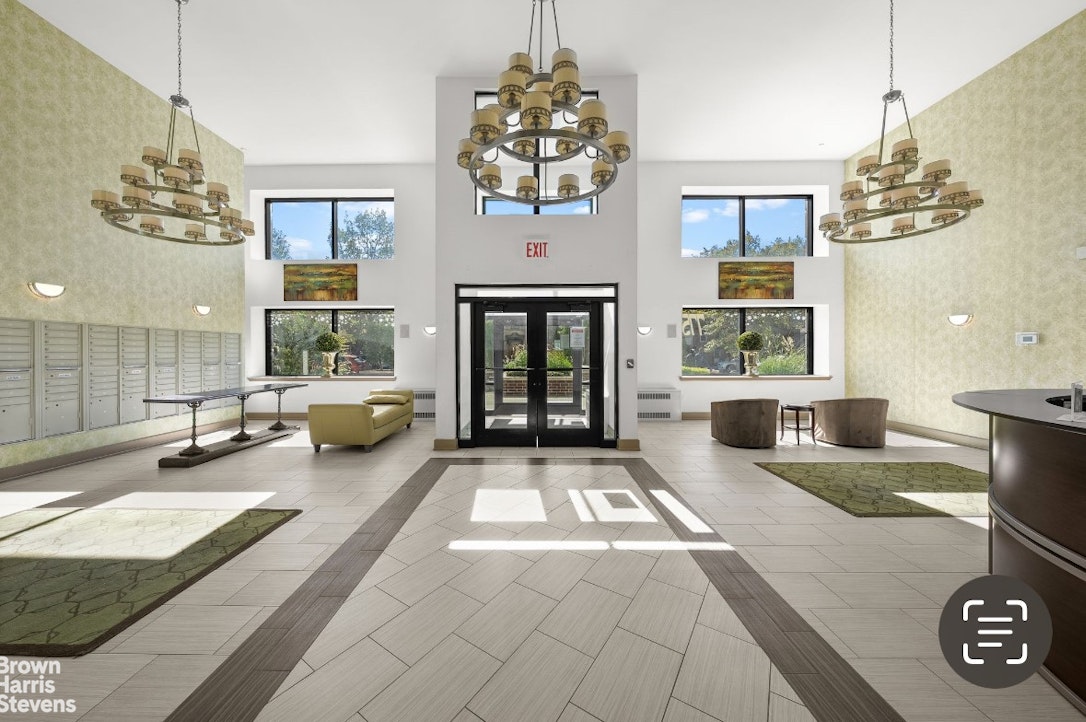 775 Lafayette Avenue, Unit 8B Brooklyn, NY 11221 - Photo 21 of 27 a living room with fireplace furniture and a chandelier