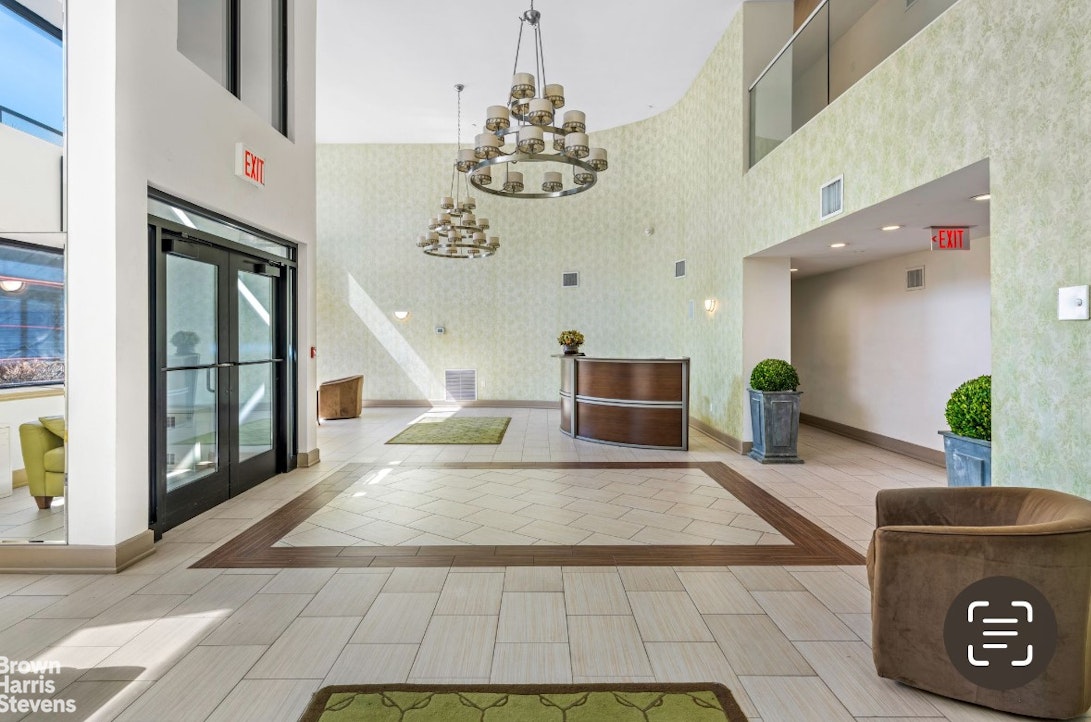 775 Lafayette Avenue, Unit 8B Brooklyn, NY 11221 - Photo 22 of 27 a view of living room with furniture and a chandelier