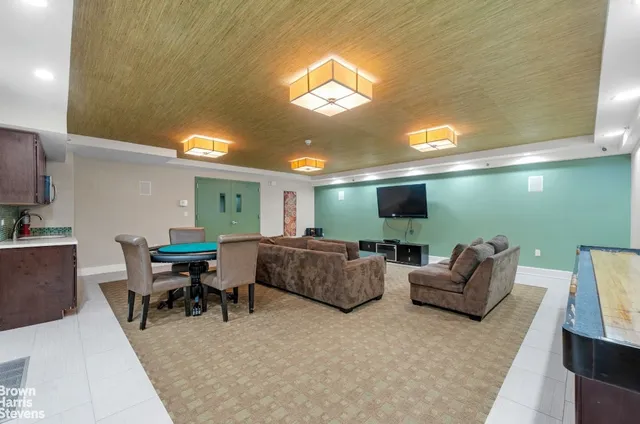 a view of living room with furniture and a chandelier