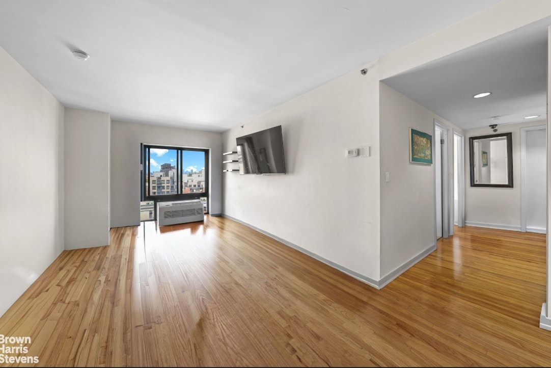 775 Lafayette Avenue, Unit 8B Brooklyn, NY 11221 - Photo 2 of 27 a view of a livingroom with wooden floor and a flat screen tv