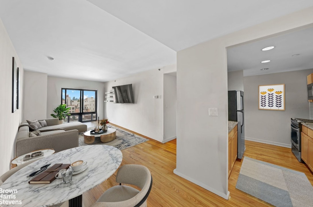 775 Lafayette Avenue, Unit 8B Brooklyn, NY 11221 - Photo 3 of 27 a living room with furniture and a flat screen tv