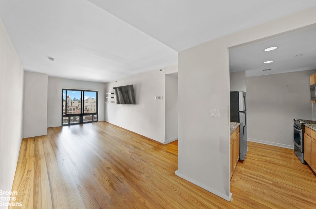 775 Lafayette Avenue, Unit 8B Brooklyn, NY 11221 - Photo 4 of 27 a view of empty room with wooden floor and window