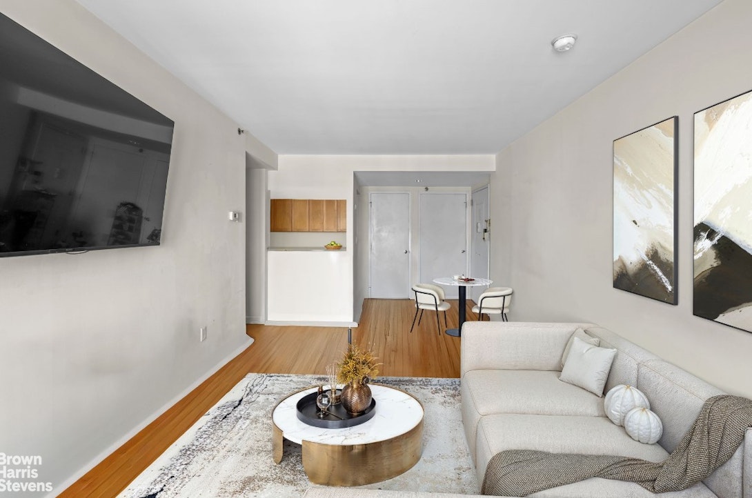 775 Lafayette Avenue, Unit 8B Brooklyn, NY 11221 - Photo 5 of 27 a living room with furniture and a flat screen tv