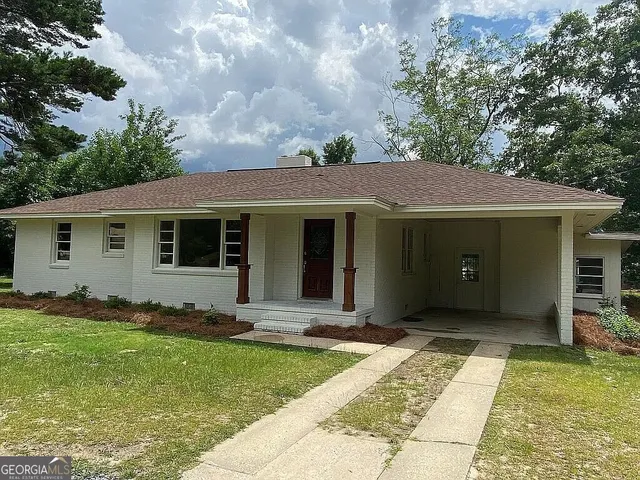 a view of a house with garden
