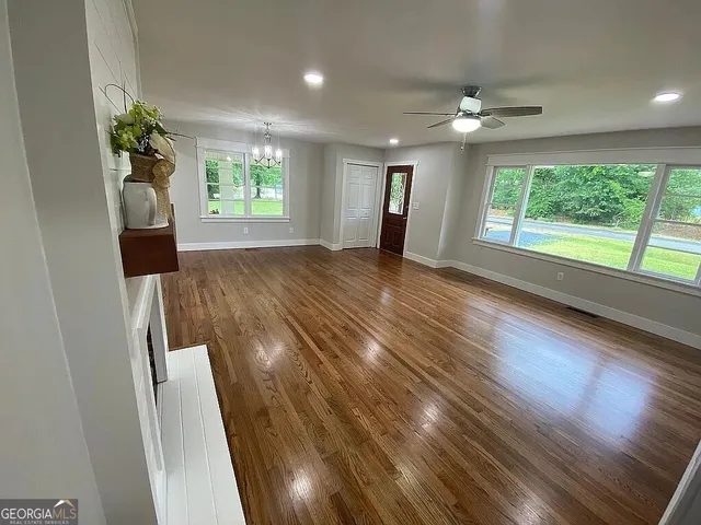 a view of livingroom with window and hardwood floor