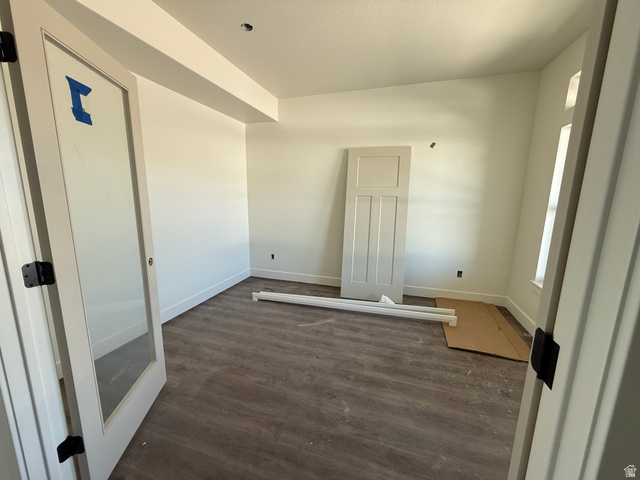3308 South 1000 West Logan, UT 84321 - Photo 5 of 14 Room featuring wood-finish flooring, white baseboards, and a recessed ceiling light