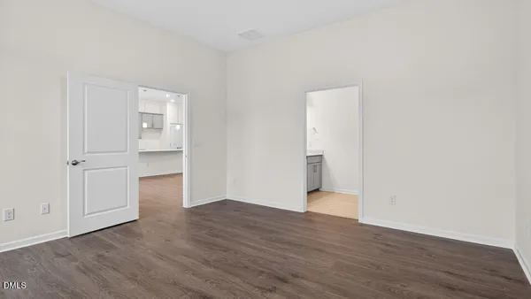 a bathroom with a sink toilet vanity and shower