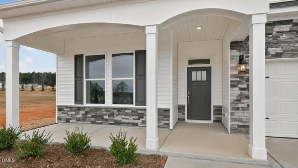 a kitchen with kitchen island a sink stainless steel appliances and cabinets