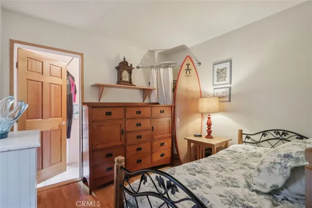 a bedroom with a bed and cabinets
