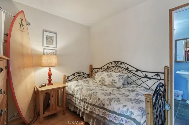 a bedroom with a bed and a dresser