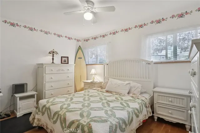an aerial view of a city with lots of residential buildings and ocean view in back