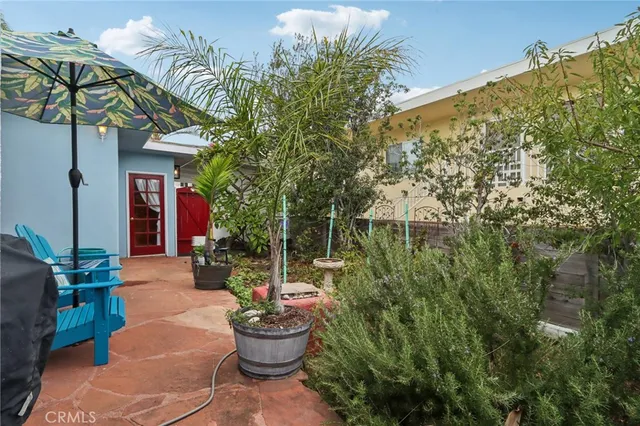a view of a chairs and table in the patio