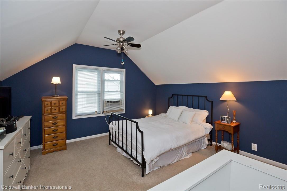 1059 Harvard Road Berkley, MI 48072 - Photo 13 of 20 2nd floor Master Bedroom is spacious and features a ceiling fan/light, exposed brick, and walk-in closet.