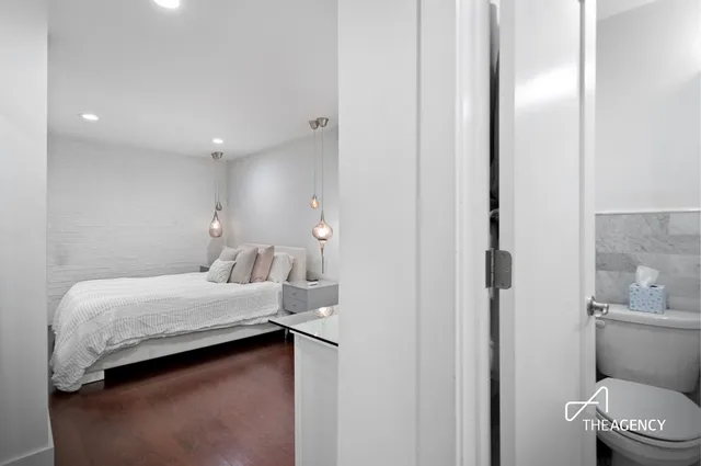 a room with a bed and a view of bathroom