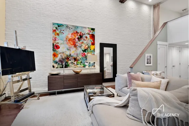 a room with furniture and a flat screen tv