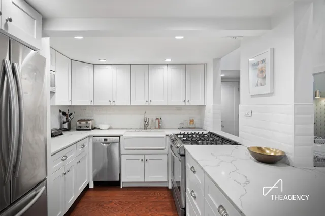 a kitchen with a sink stove and refrigerator
