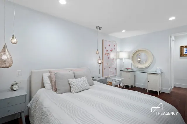 a bedroom with a bed and a table in it